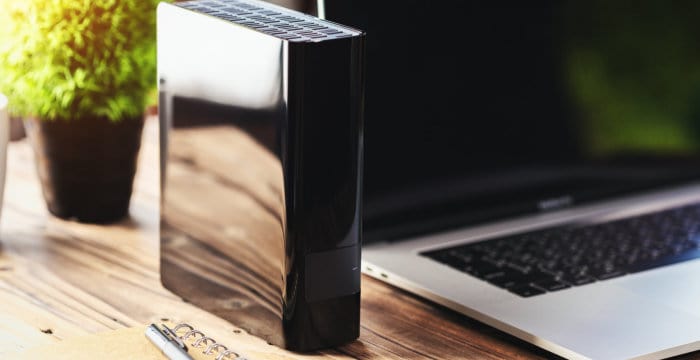 how to make backups faster - external drive on desk featured